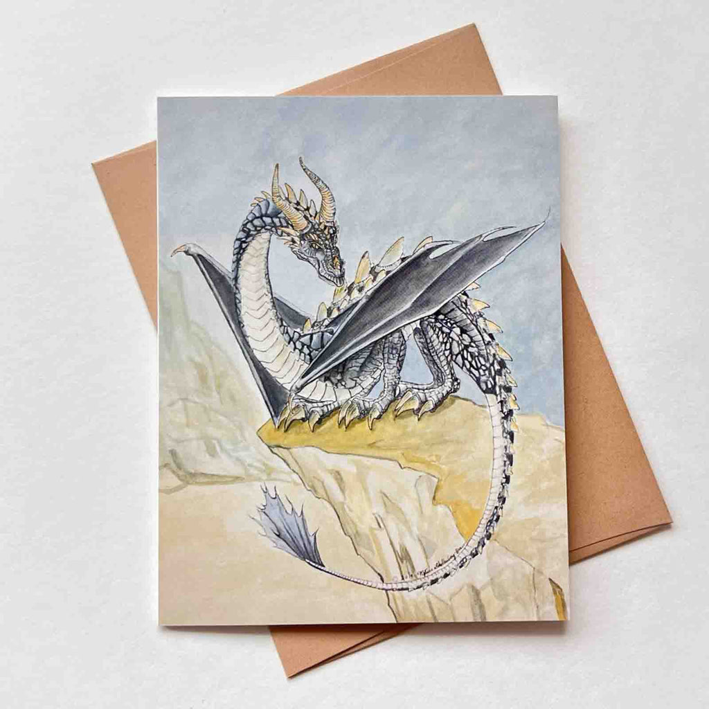 a black and gold dragon perched on a cliff