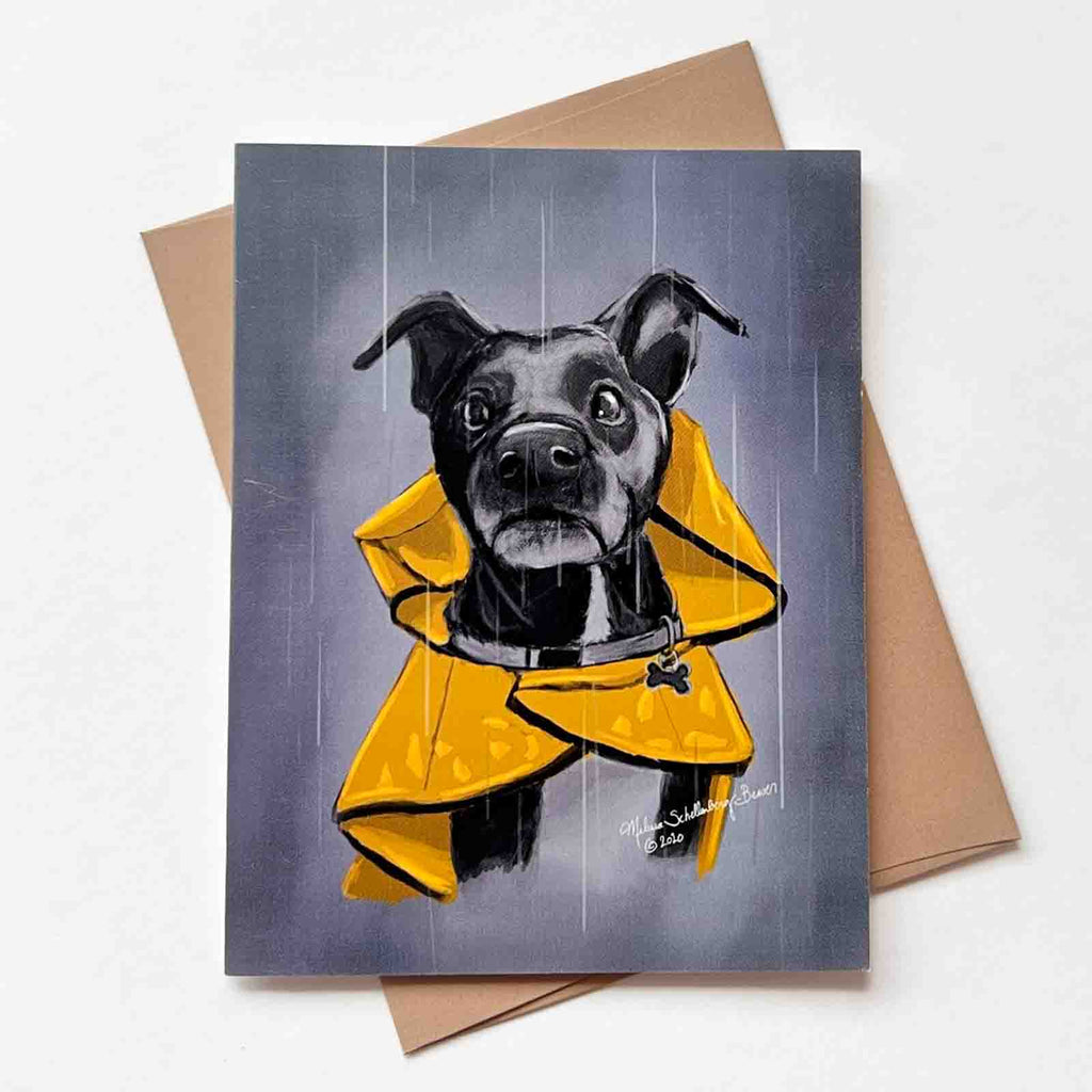 a black dog wearing a yellow rain coat in the rain