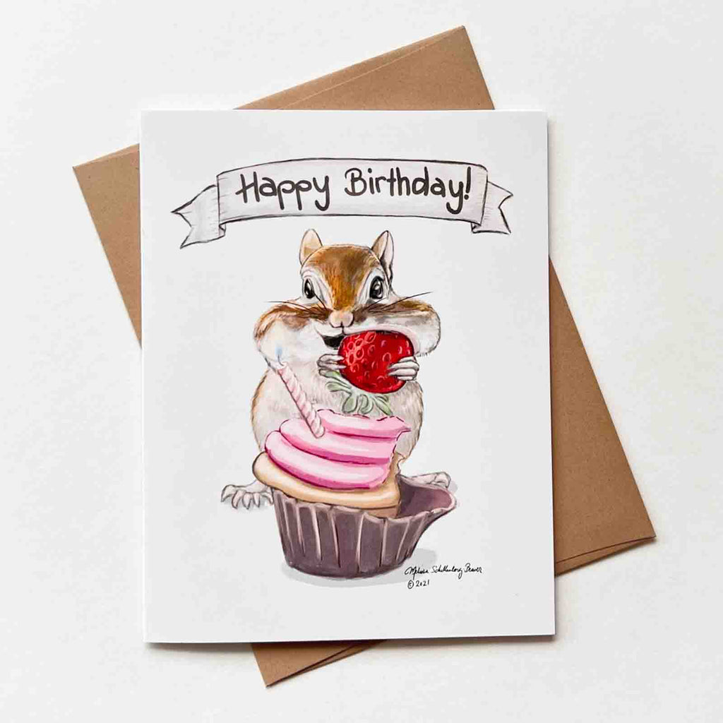 a chipmunk stuffing his cheeks with a strawberry cupcake