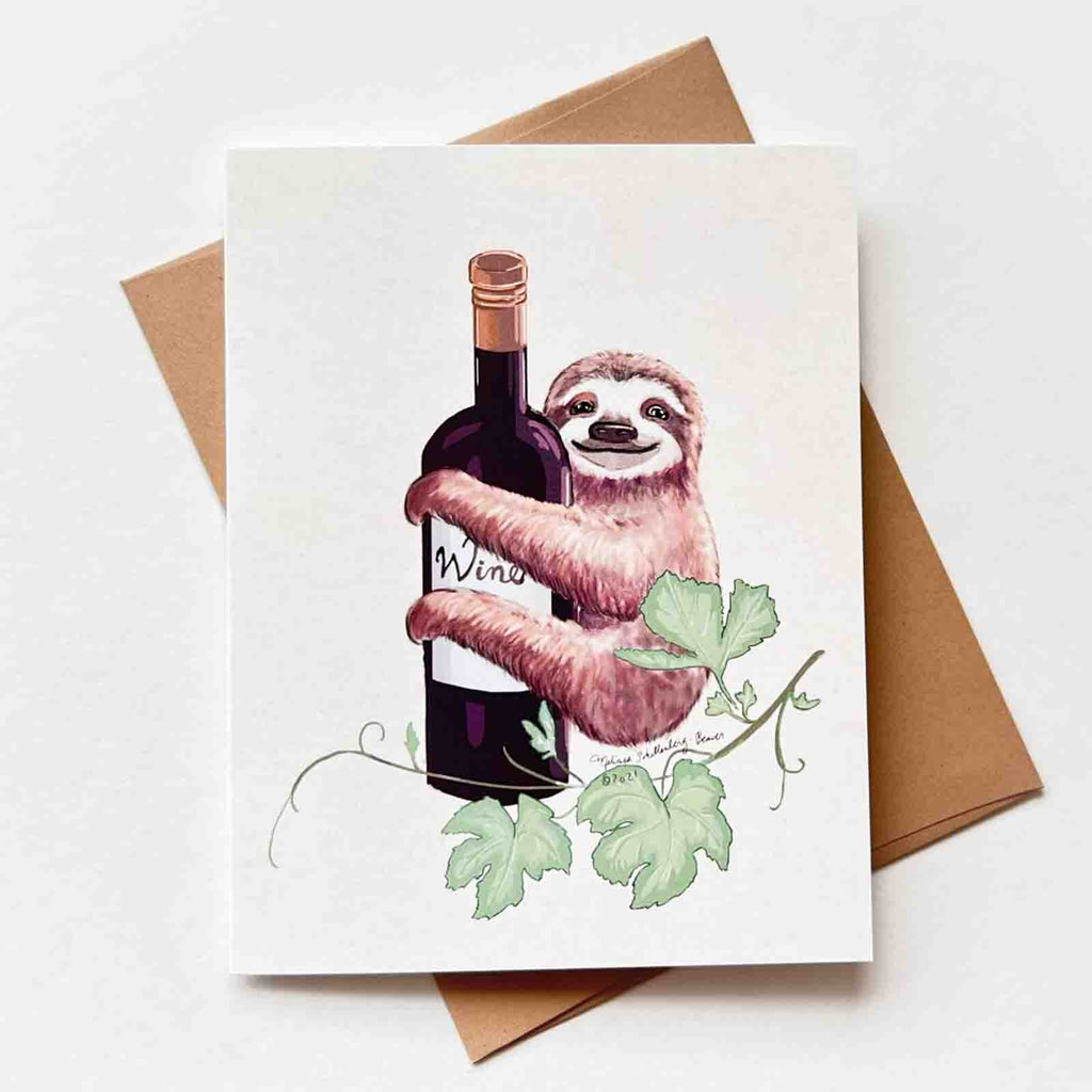 a greeting card featuring a sloth hugging a bottle of wine