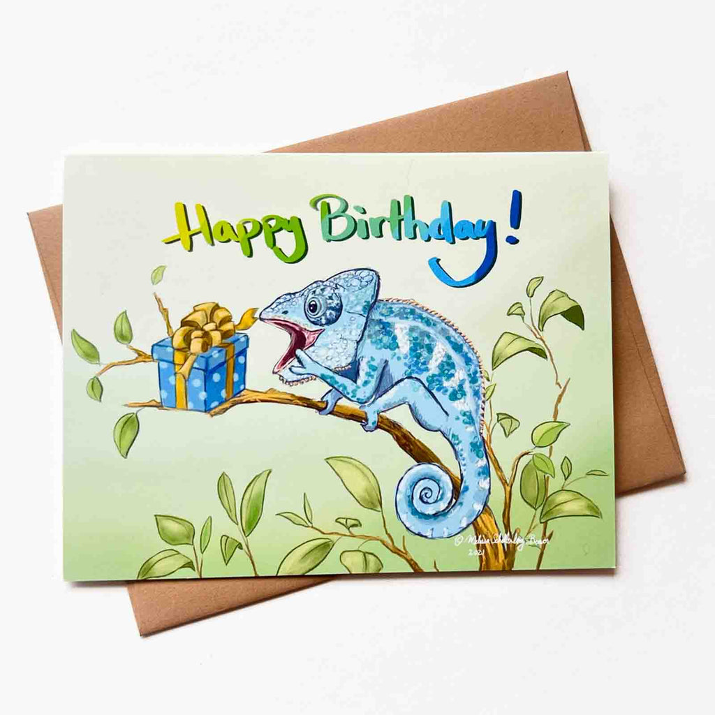 a birthday card featuring a chameleon delighted by his surprise birthday present