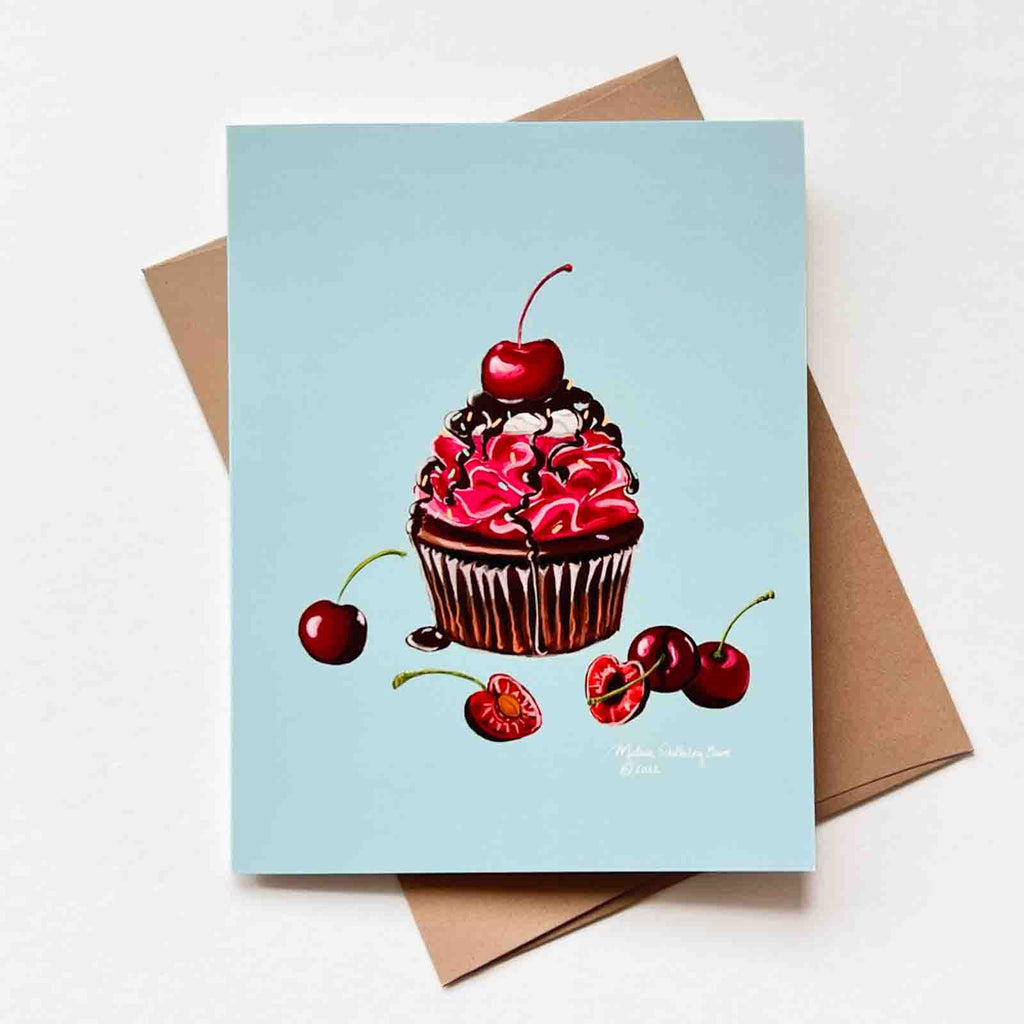 a cute notecard featuring a delicious chocolate cherry cupcake