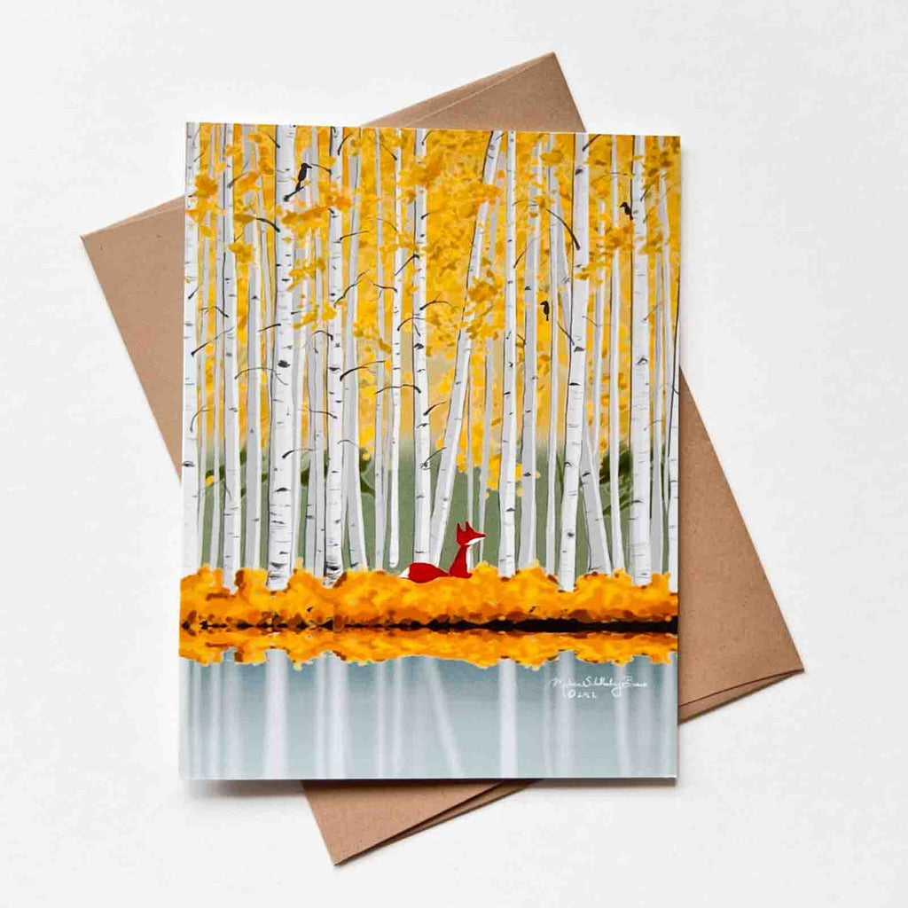 This fall themed greeting card features a beautiful golden birch forest with a little red fox in the center. A few black crows are sitting on the trees.