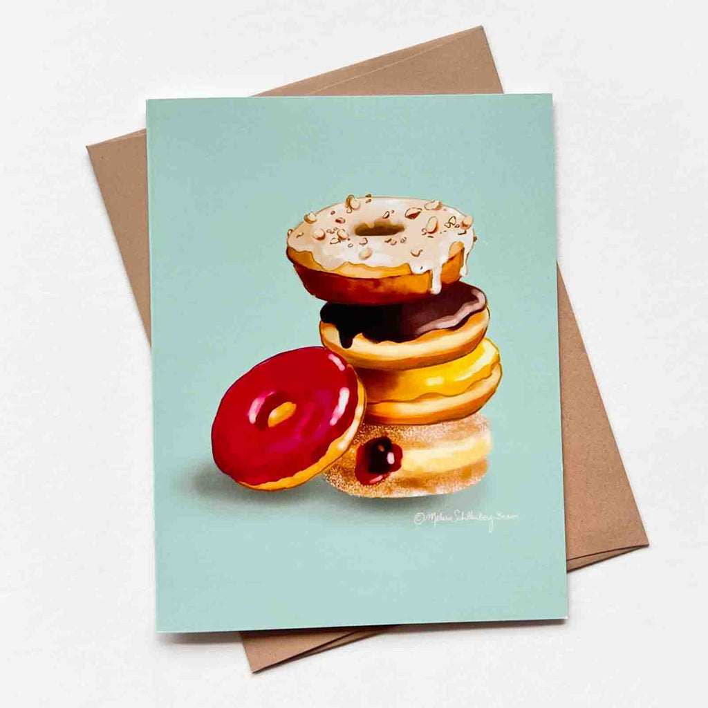 This greetting card features a stack of delicious looking donuts 