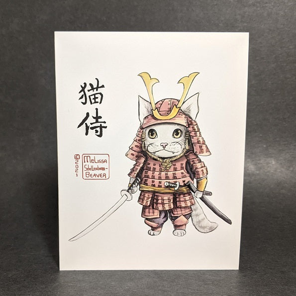 a greeting card featuring a cat dressed in a red Samurai armor