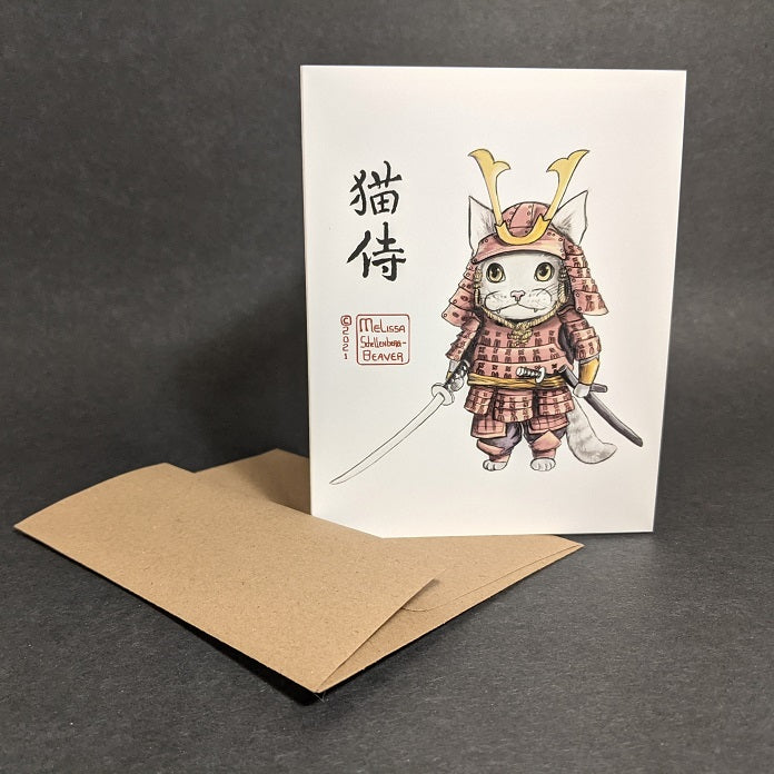 a greeting card featuring a cat dressed in a red Samurai armor