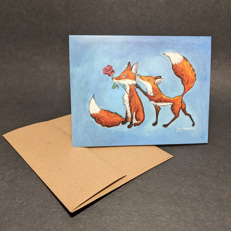 a love themed greeting card featuring a red fox is surpsinging another fox with a rose