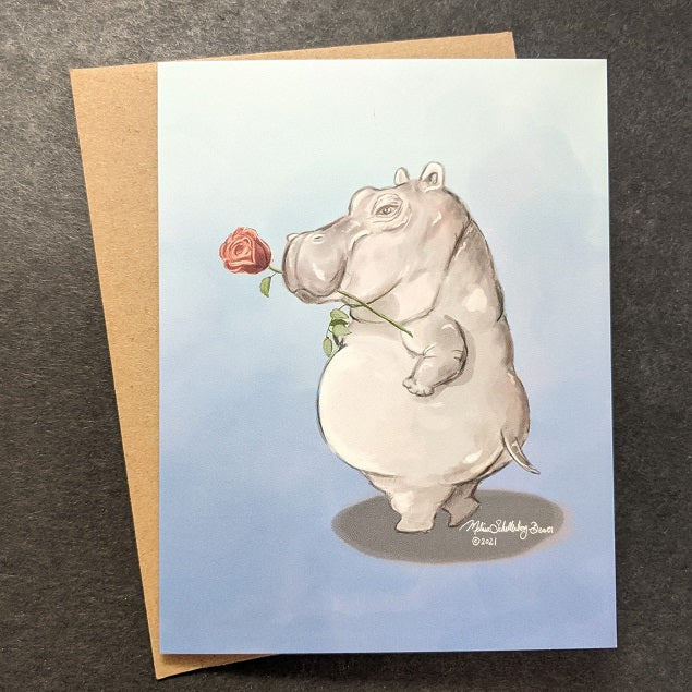 a love card featuring a flirtatious hippopotamous in a sexy pose with a rose between his teeth