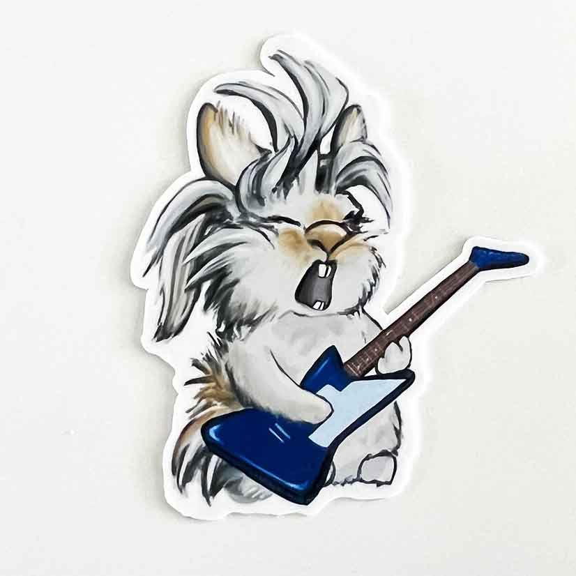 a 3 inch vinyl sticker featuring a bunny playing a guiltar and singing like a rock star