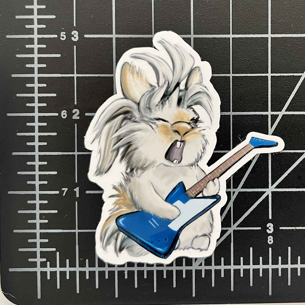 a 3 inch vinyl sticker featuring a bunny playing a guiltar and singing like a rock star