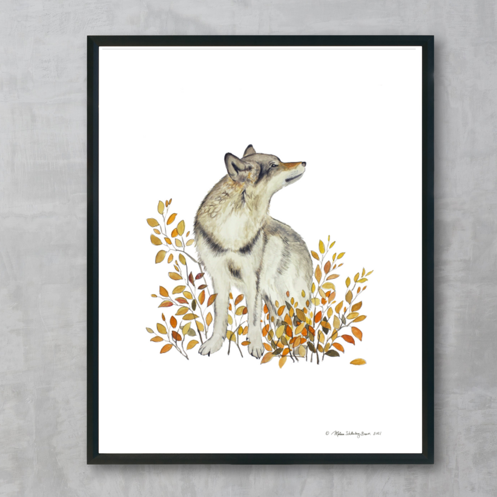 A fine art print featuring a wolf standing in front of a bush