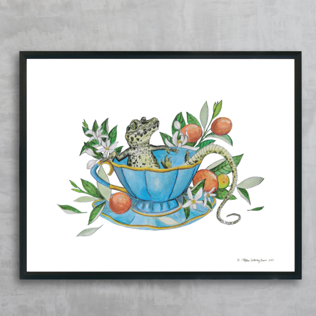 A fine art print featuring a lizard lounging in a blue tea cup surrounded by kumquats